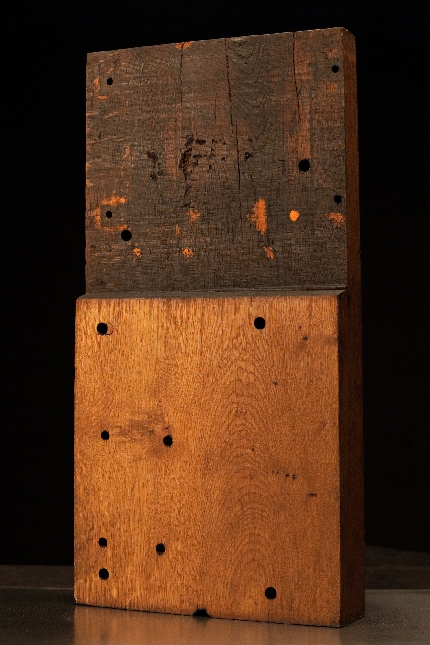 Front view of a relic-grade architectural stepped oak monolith featuring a dark weathered top and certified heritage golden base.