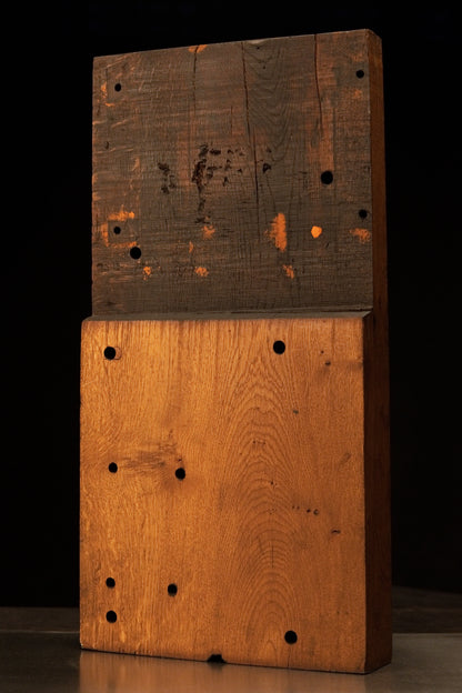 Front view of a relic-grade architectural stepped oak monolith featuring a dark weathered top and certified heritage golden base.