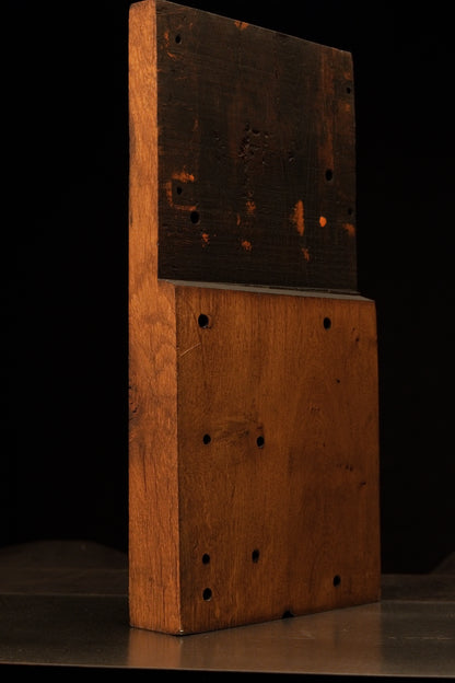 Left angled profile of a relic-grade timber block showing the structural architectural ledge where the dark and light wood meets. 
