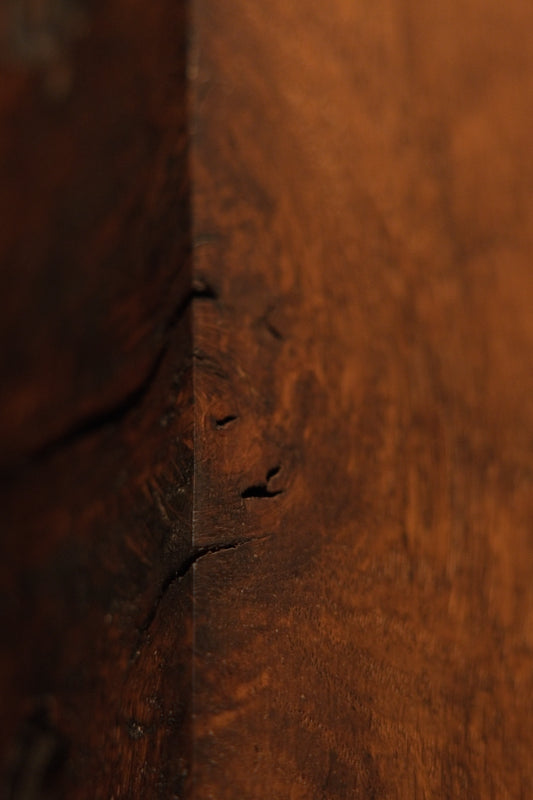 Detailed view of a micro-porous natural wood void inside the heritage relic piece demonstrating structural thermal stability. 