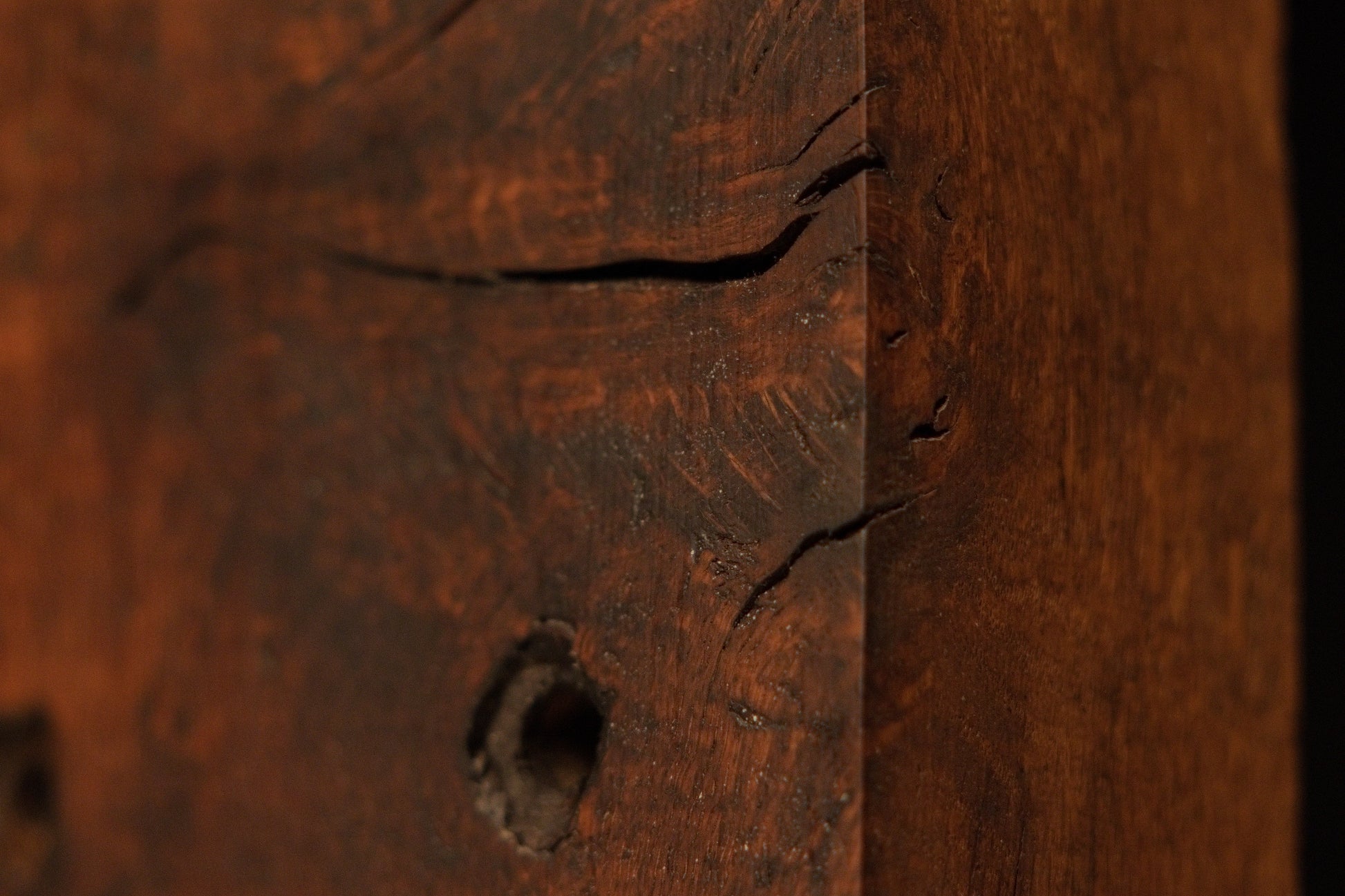 Close detail of a stabilized natural wood check on the relic grade timber block showing authentic dimensional character traits. 