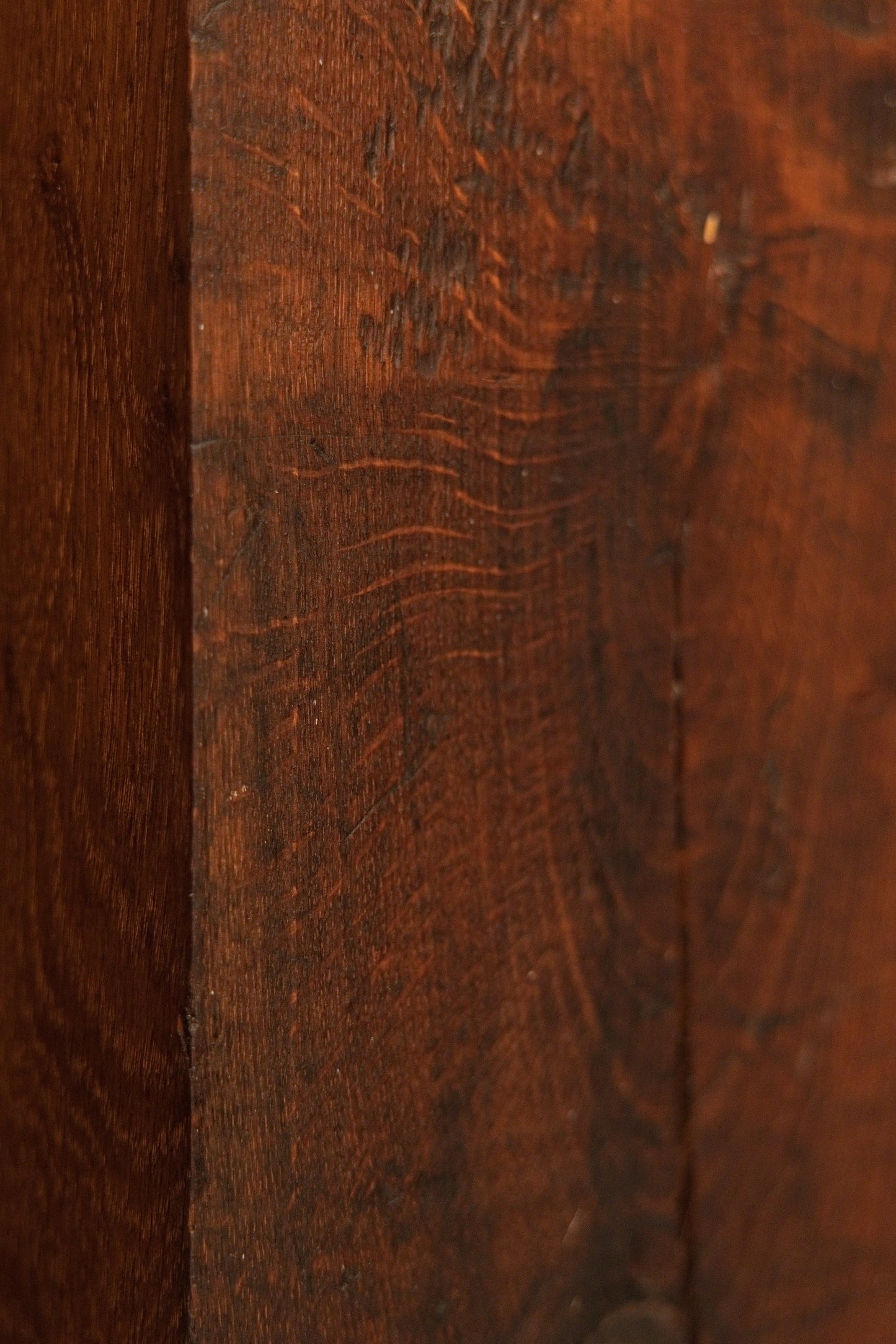Close detail of the vertical wood grain on the heritage structural element highlighting natural hygroscopic equilibrium marks. 