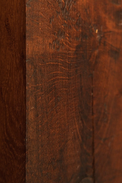 Close detail of the vertical wood grain on the heritage structural element highlighting natural hygroscopic equilibrium marks. 