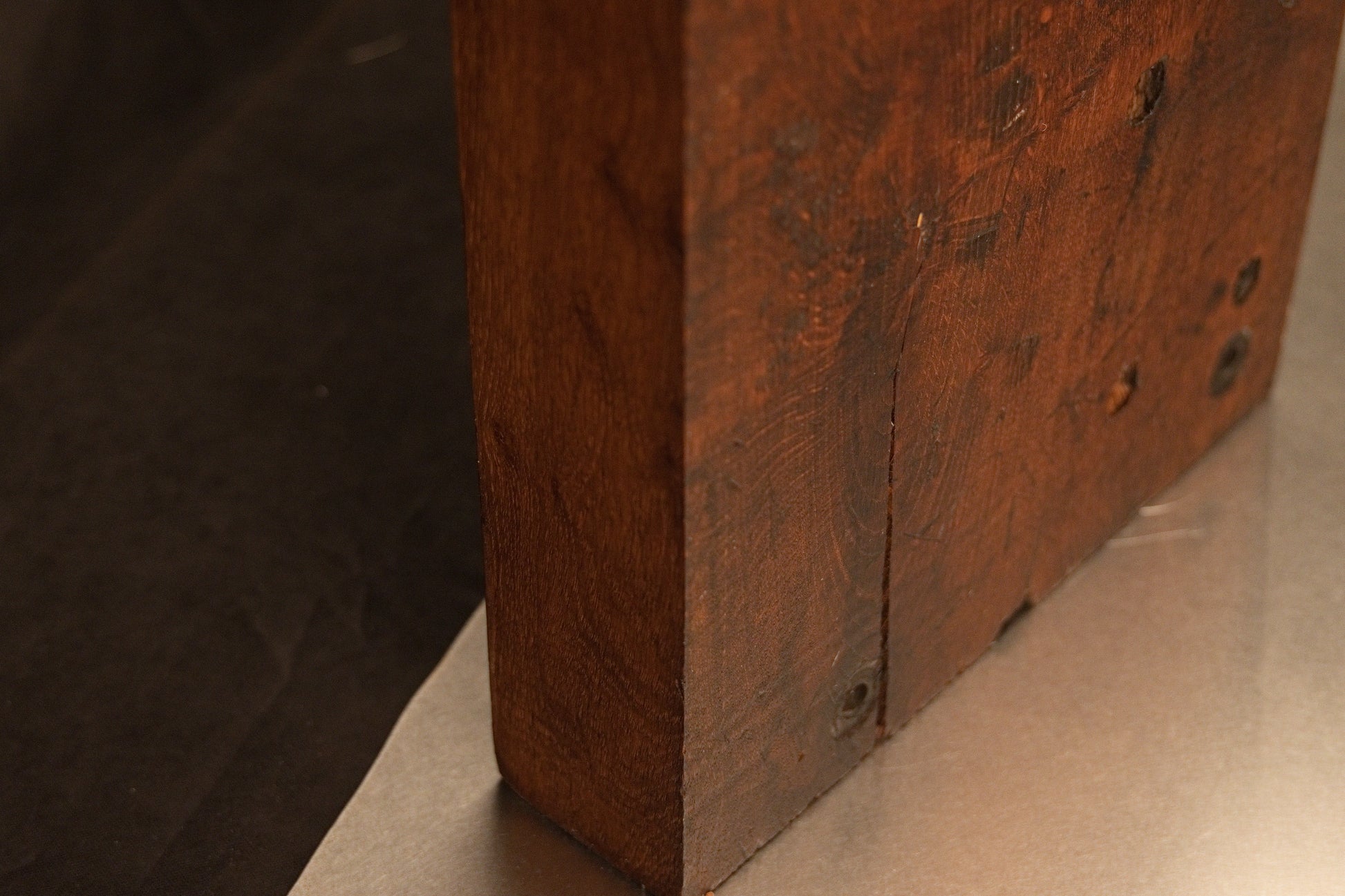Lower side profile of the thick-cut monolithic wood slab highlighting the precision cut base and stabilized organic cell structure. 