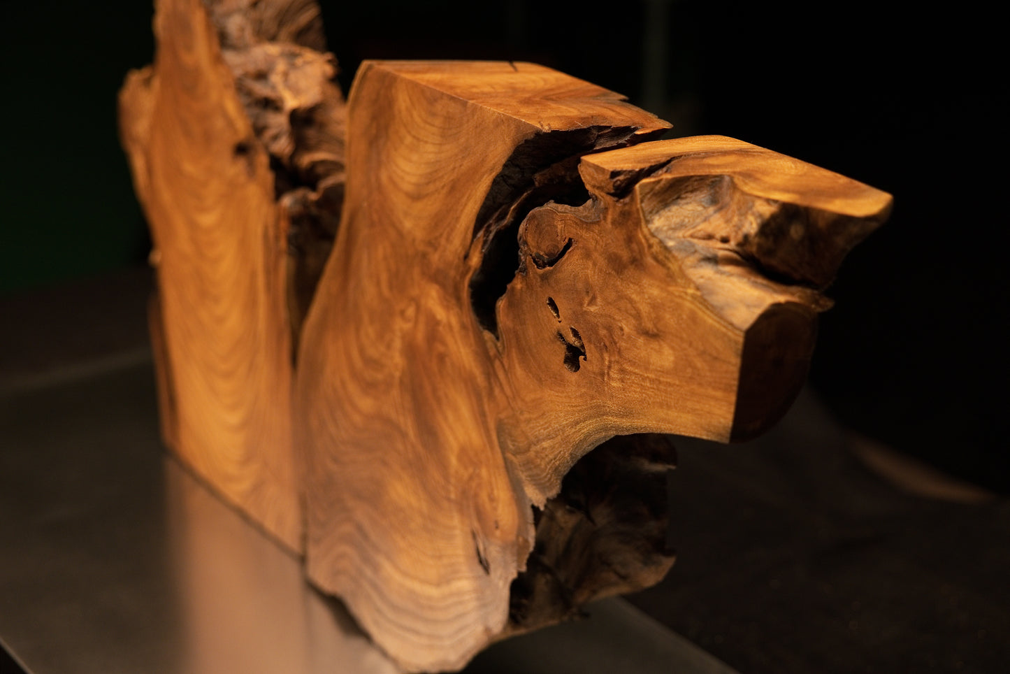 Angled perspective of the medium oak root sculpture highlighting its chunky form, hollow core, and rich dark organic surface contours.