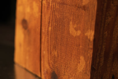 Close-up of organic surface indentations on a perfectly preserved biophilic structural beam engineered for high-end real estate.   