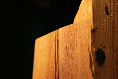 Macro focus on the sharp precision-cut slanted corner of a fully stabilized botanical heritage beam highlighting true patina.   