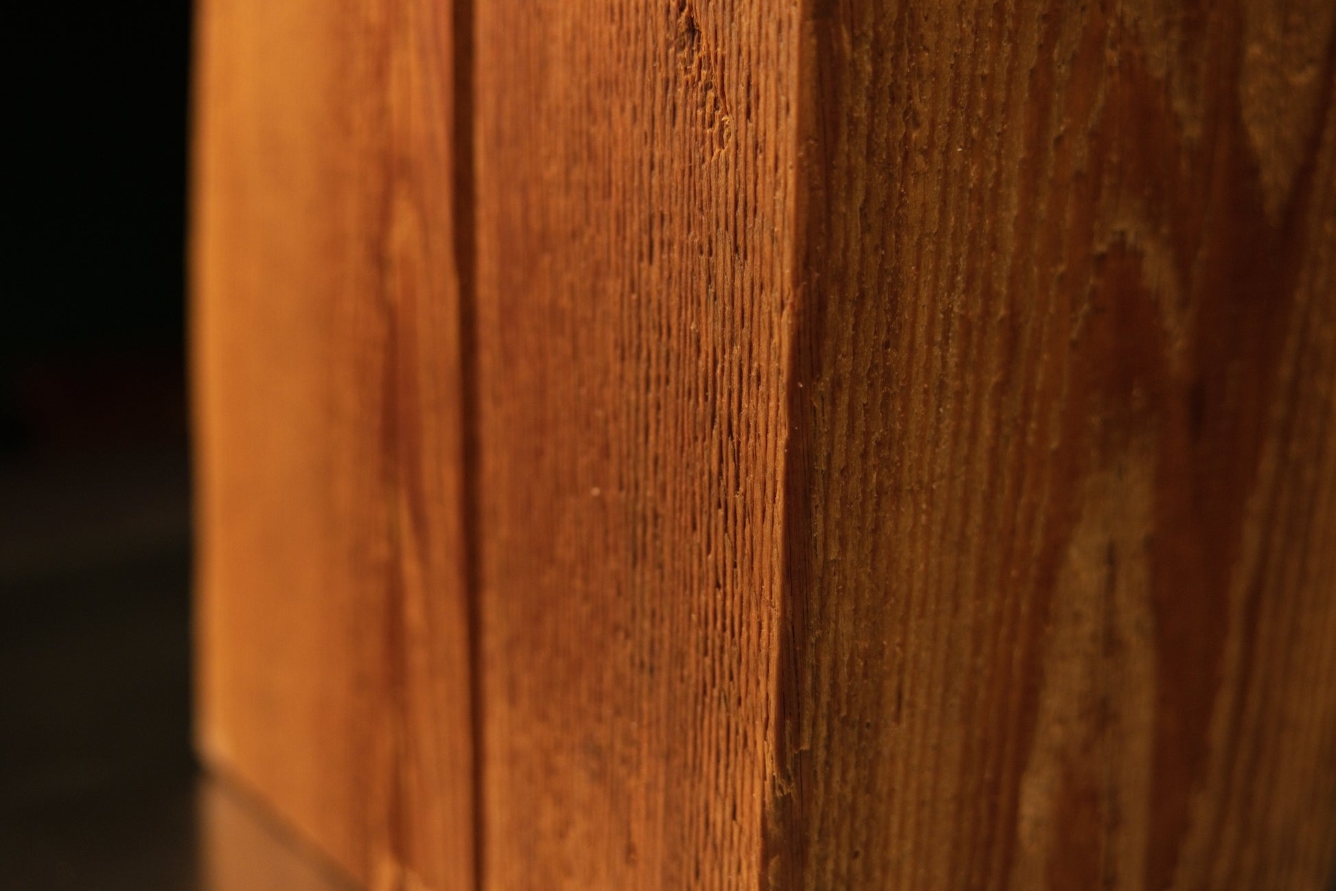 Angled close-up along the side profile of a digital twin ready structural monolith emphasizing organic dimensional stability.   