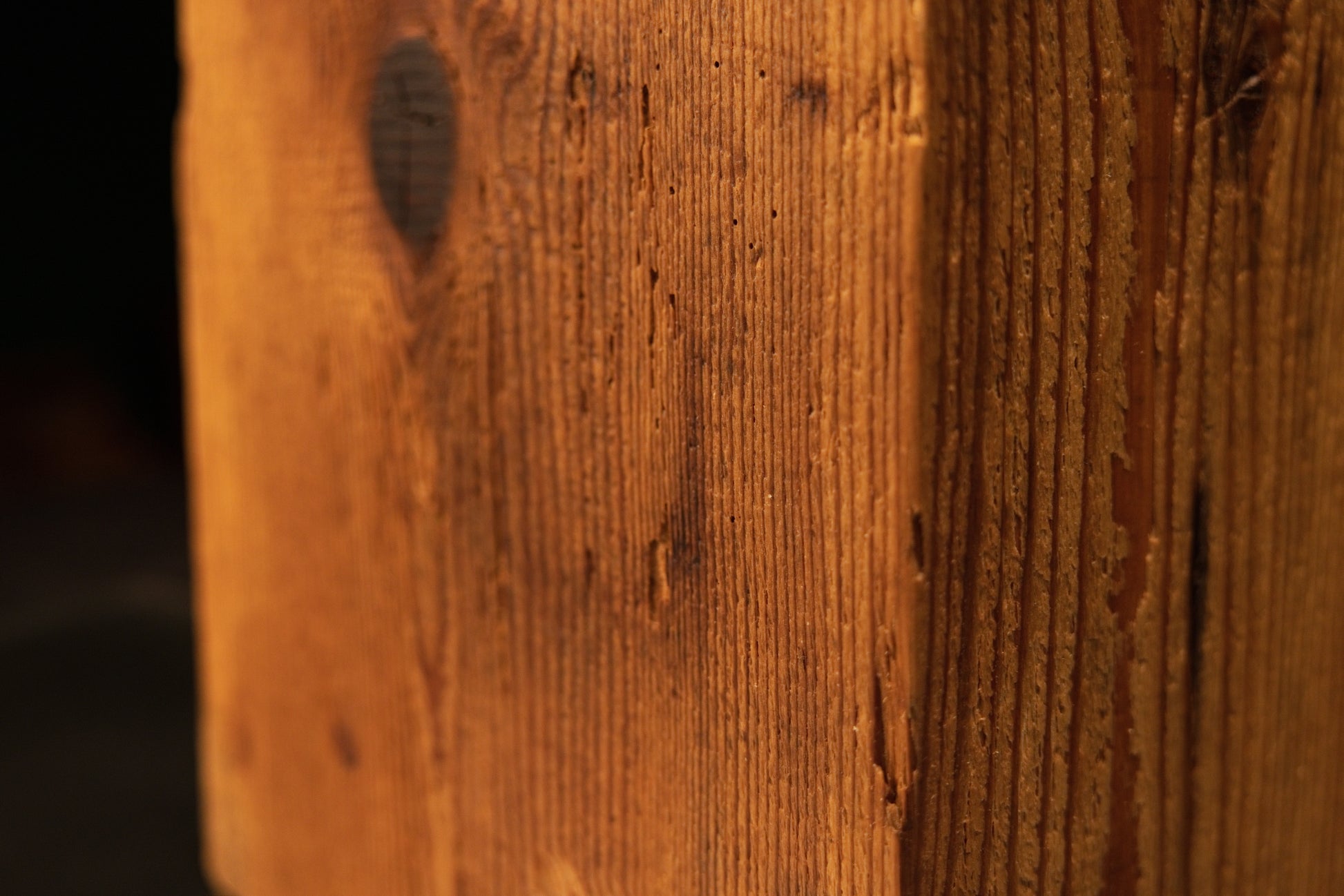 Detailed macro of the pristine flat face on a structural wooden block revealing deep cellular organic grain.   