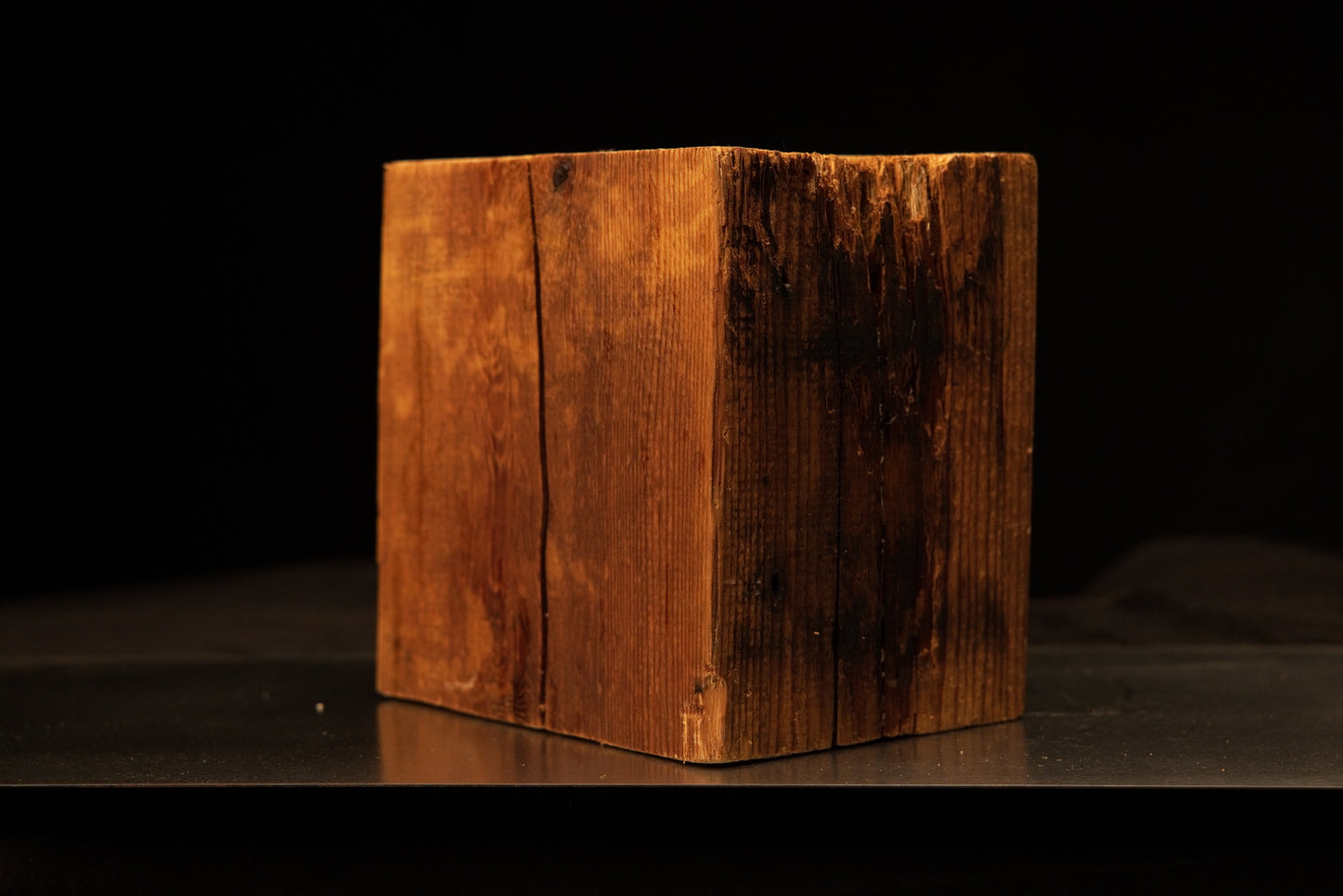Straight frontal perspective of a climate-stable architectural salvage block displaying golden grain and a dark weathered side.[cite: 1, 3]