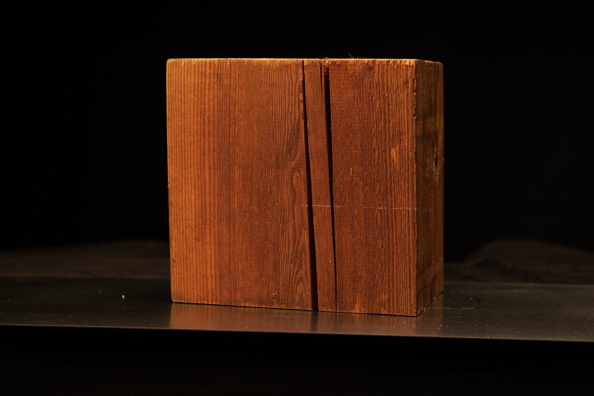 Central focus on a structural vertical split within a digital twin ready biophilic wood block demonstrating true organic tension.[cite: 1, 3]