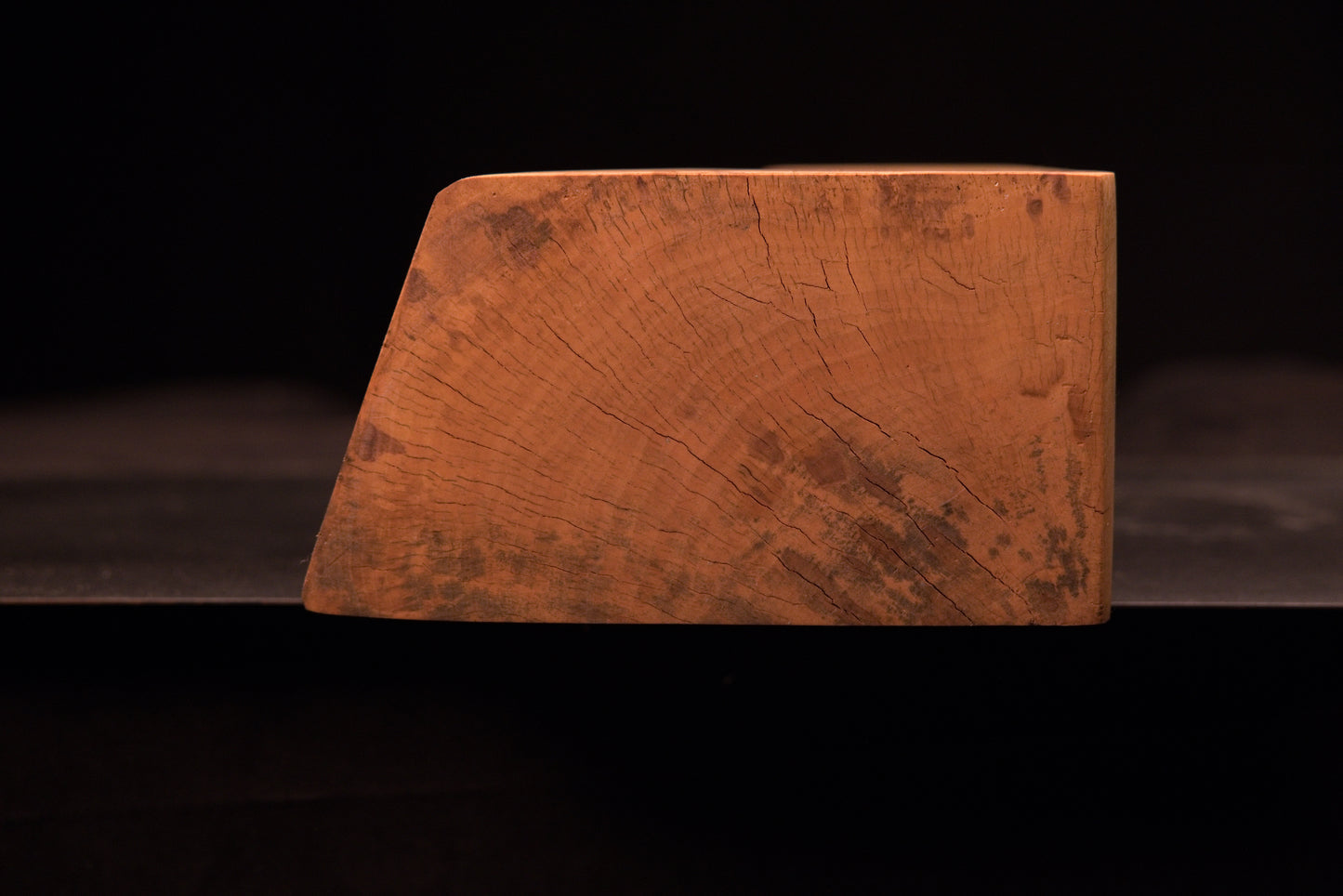Extreme macro view showing stabilized natural wood checks and smooth botanical textures on a climate-stable architectural slab.   
