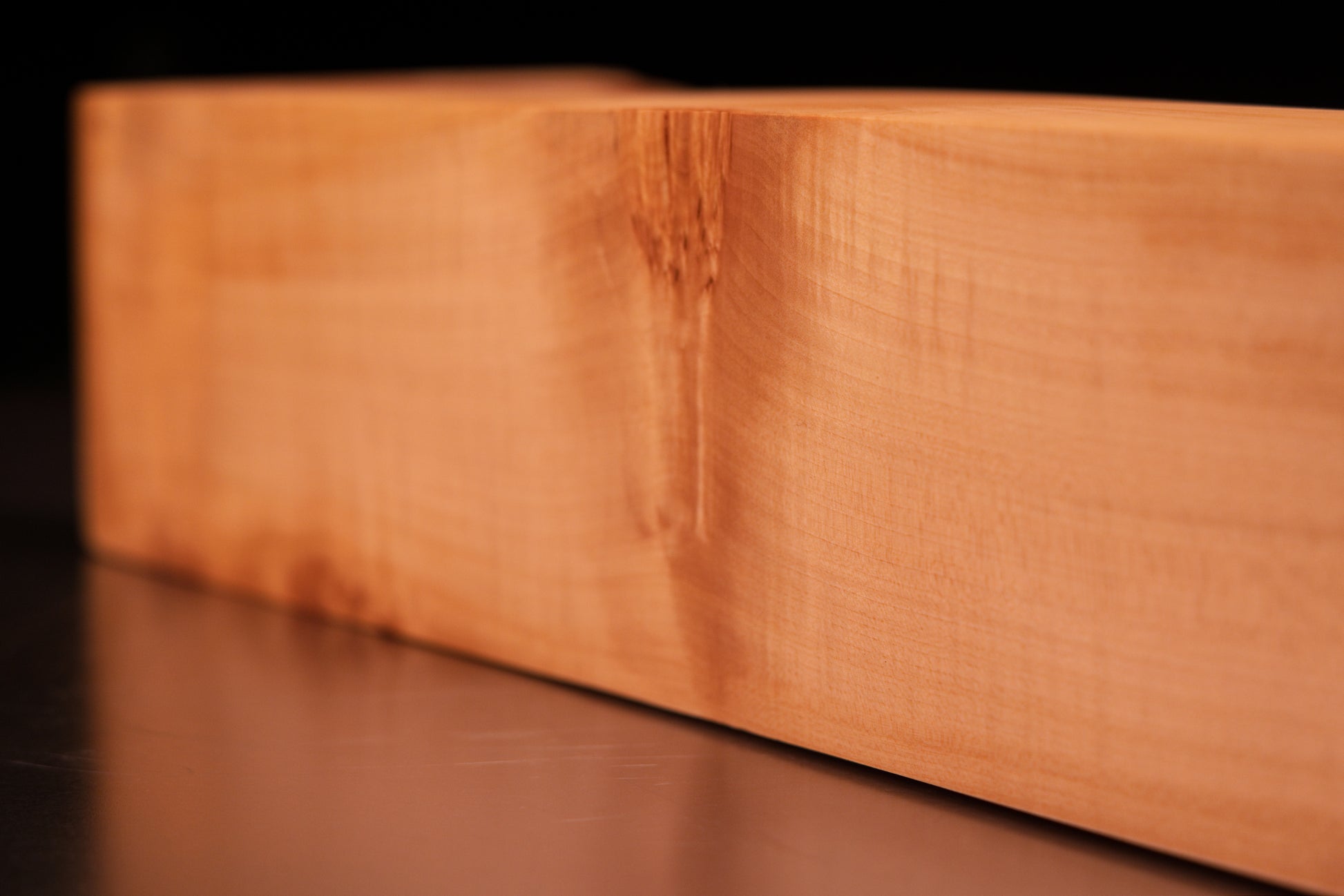 Extreme close-up on the crisp precision cut corner of a resin-free structural wooden block showing flawless surface chemistry.   