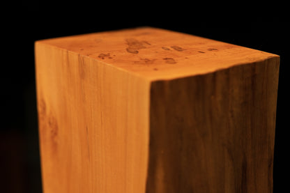 Macro detail of a central stabilized check in the polished wooden surface demonstrating absolute hygroscopic equilibrium.   