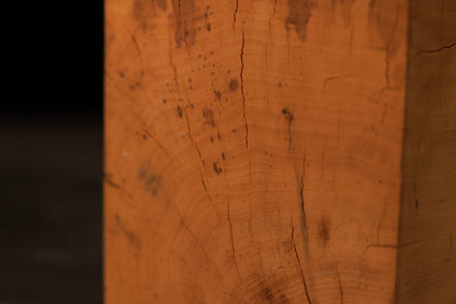 Angled rear profile of the climate-stable structural wood block showcasing a smooth flat cut and a flowing organic side.   
