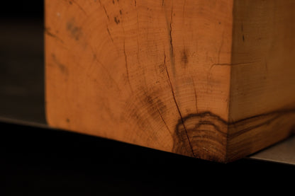 Detailed focus on the wavy, sculpted organic edge of a Relic-Grade wooden art piece showing absolute dimensional stability.   
