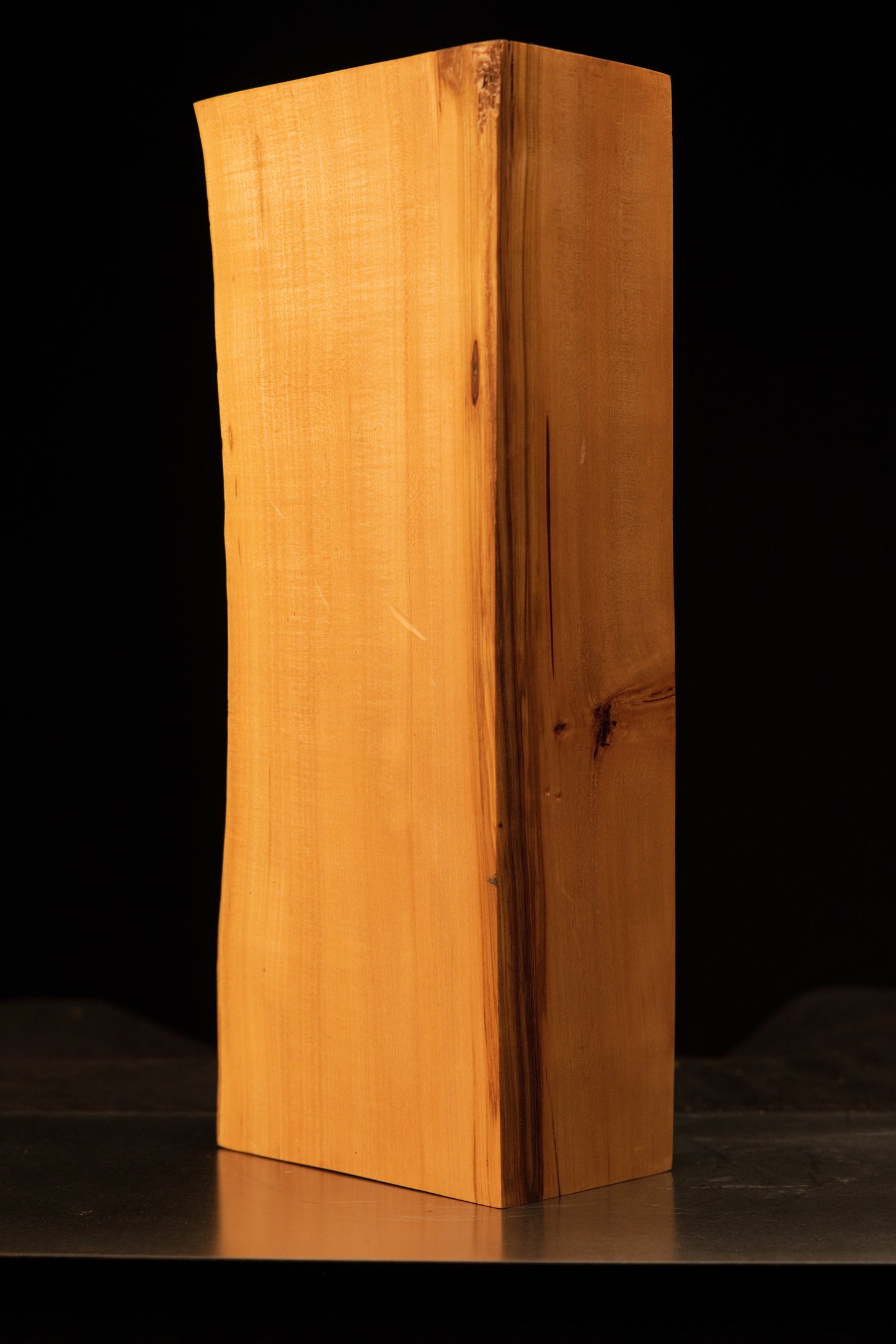 Top corner perspective of a biophilic structural wood block displaying absolute organic dimensional stability.   