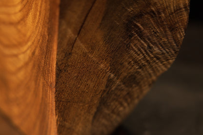 Slanted presentation of a climate-proof interior timber showcasing an upper jagged shadow pocket and undulating lines.   