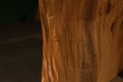 Macro photography highlighting straight vertical golden grain lines across the smooth flat face of a premier gallery-quality wood item.   
