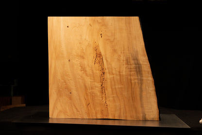 Detailed view of the jagged vertical structural split embedded in the smooth polished face of a climate-stable architectural slab.  