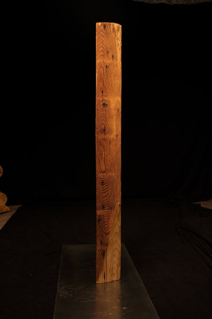 Side profile of a standing epoxy-free architectural wood block highlighting dense vertical grain and a smooth precision cut base. 