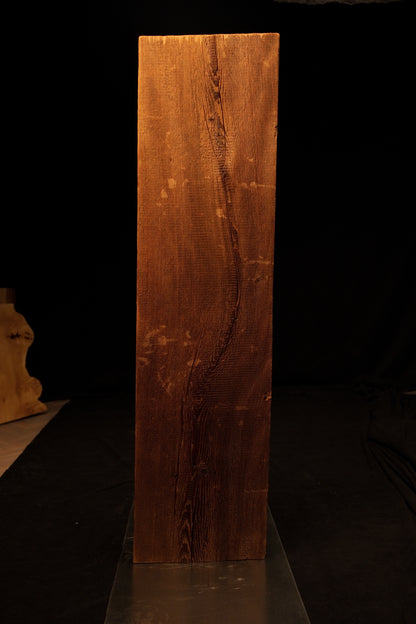 Detailed front view of the highly textured face on a museum-quality biophilic structural centerpiece showing deep wood furrows. 