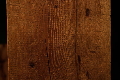 Detailed view of deep organic grooves and highly textured vertical grain lines displayed on a museum-quality biophilic element. 