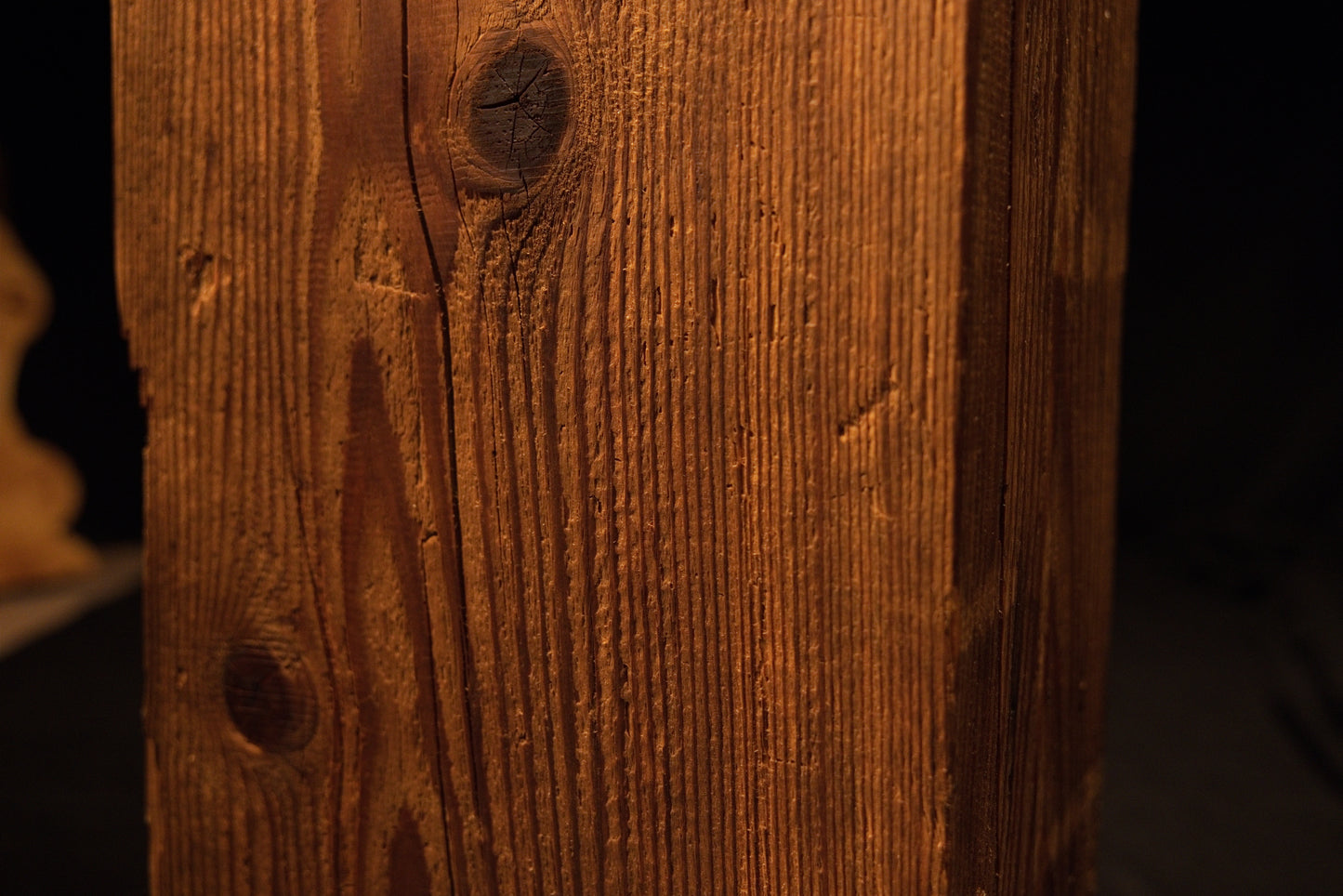 Detailed view of smooth sweeping vertical grain lines and subtle color transitions on a floor-heating compatible timber. 