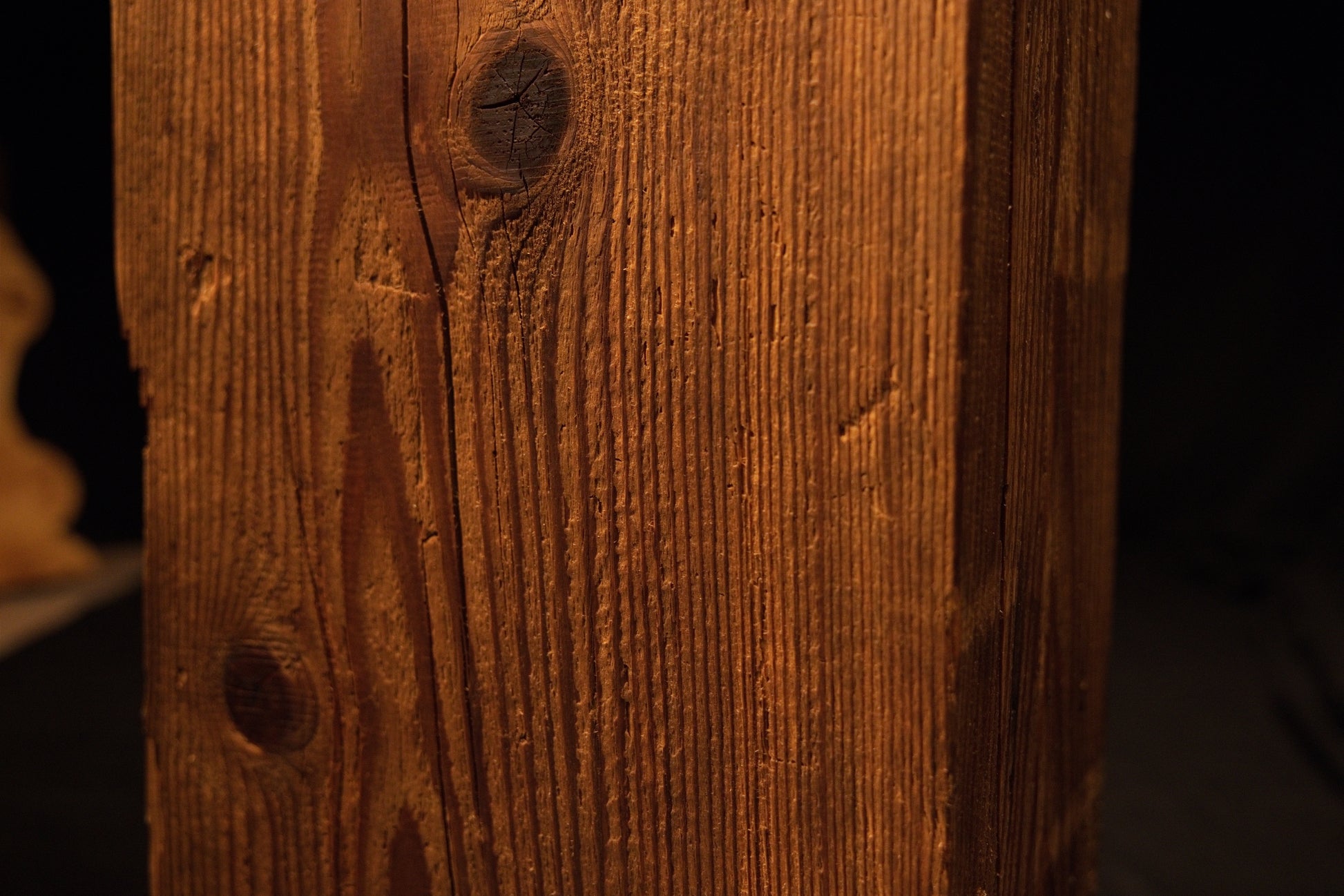 Detailed view of smooth sweeping vertical grain lines and subtle color transitions on a floor-heating compatible timber. 