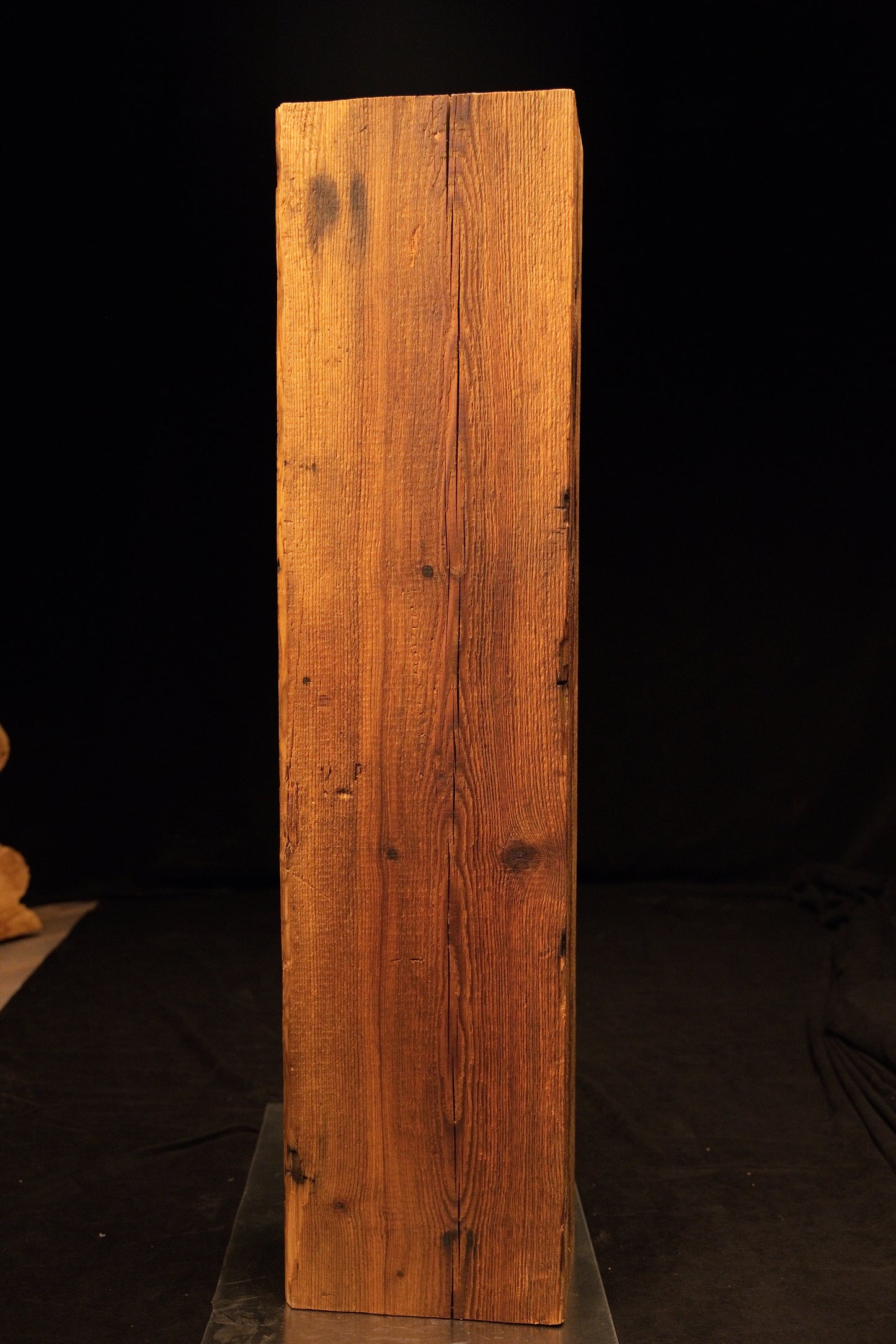 Side profile of a standing epoxy-free architectural wood block highlighting dense vertical grain and a smooth precision cut base.  