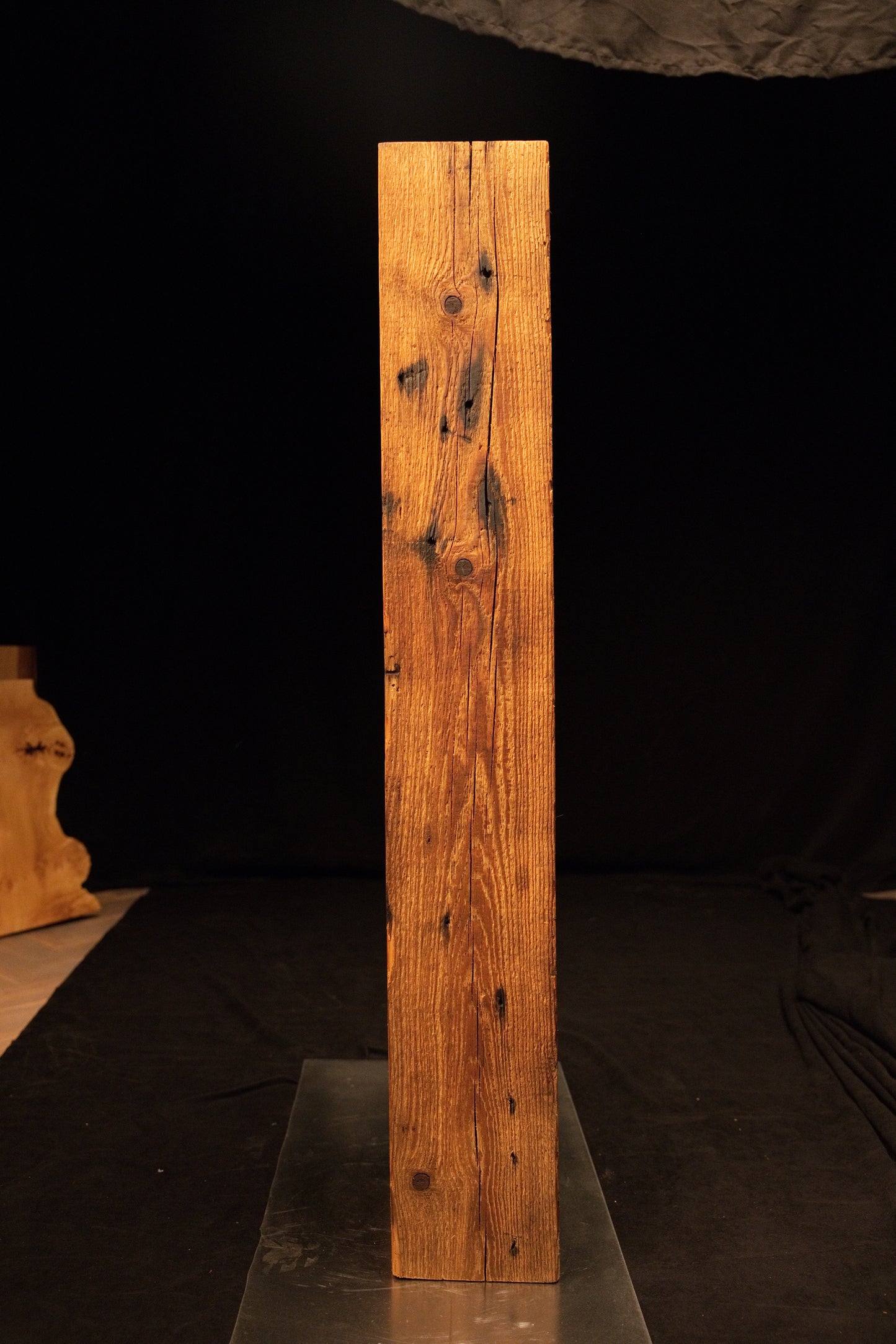 Straight frontal perspective of a tall floor-heating compatible wooden slab showcasing tight vertical grain and a flat top cut.  
