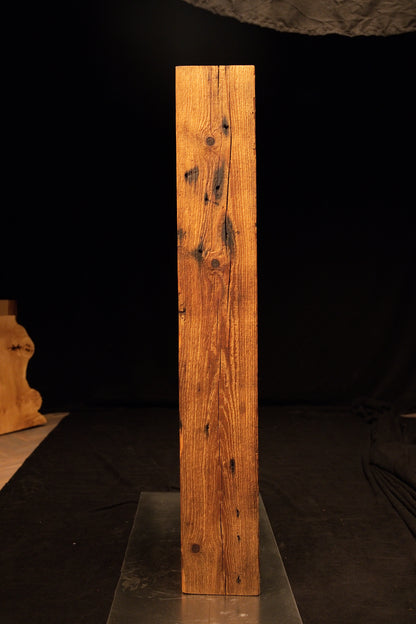 Straight frontal perspective of a tall floor-heating compatible wooden slab showcasing tight vertical grain and a flat top cut.  
