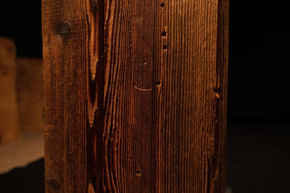 Macro photography revealing dark organic spotting nestled within the deeply furrowed golden grain of an epoxy-free timber slab.  