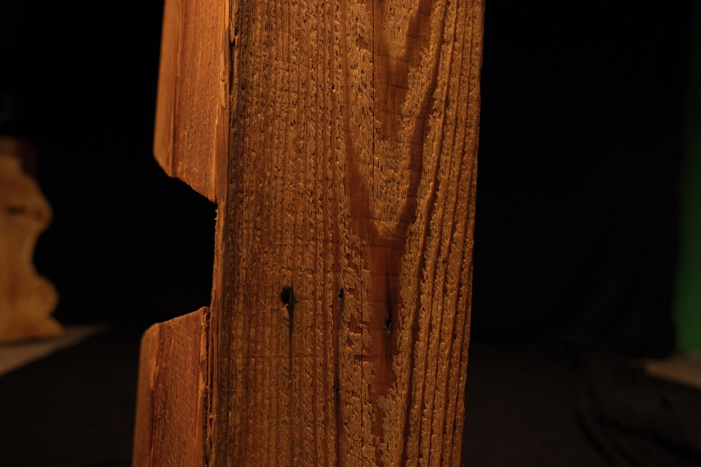 Macro view of a clean recessed notch cut into the vertical grain face of a climate-stable architectural timber block. 