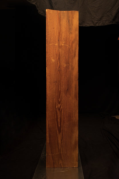 Full standing elevation of a museum-quality biophilic wooden monolith displaying rich golden hues and uniform vertical lines. 