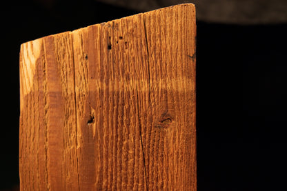 Straight vertical macro perspective highlighting clean golden grain lines on a fully stabilized architectural wood element. 