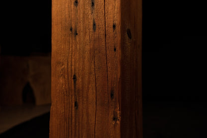 Detailed close-up of the lower-middle beam section showing straight vertical grain lines and dark organic pinholes. 