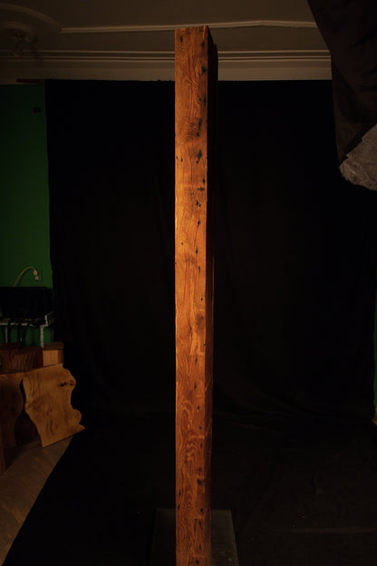 Straight front perspective of a floor-heating compatible wooden column showcasing uniform vertical grain and warm brown hues. 