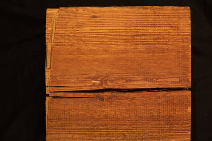 Frontal perspective of an epoxy-free architectural timber block showing a prominent horizontal fracture and precise edge joinery. 