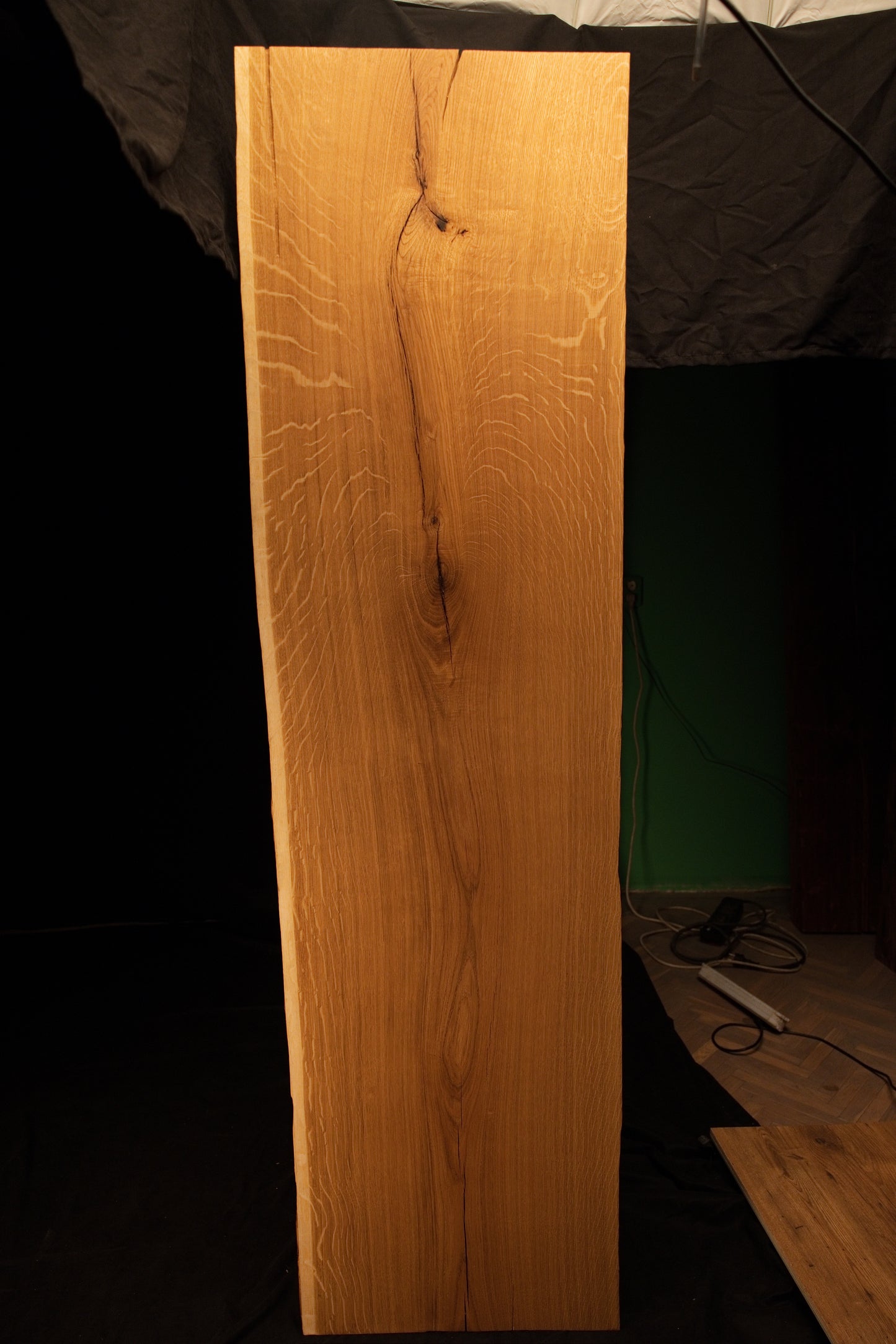 Straight frontal perspective of the vertical oak mirror panel highlighting natural grain variations and a stabilized upper crack.
