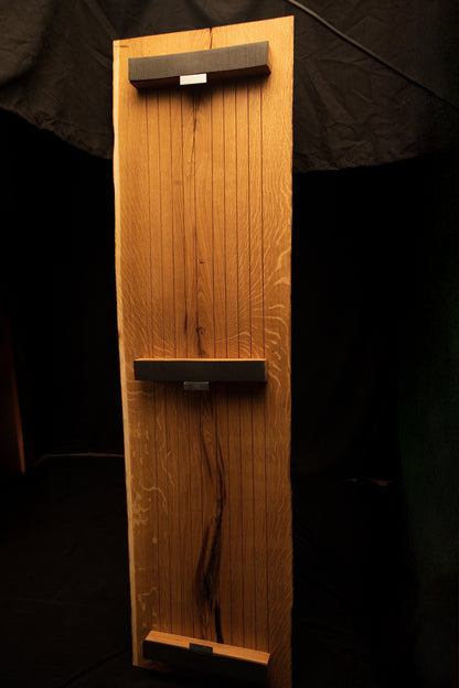 Full back elevation of a custom oak mirror frame featuring three dark horizontal mounting crossbars secured across vertical slats. 