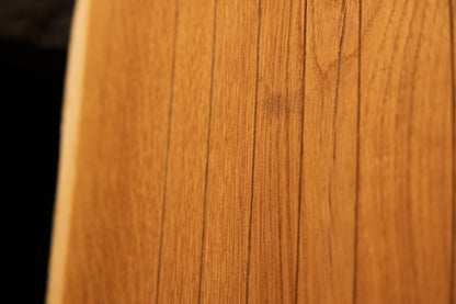 Macro close-up of fine vertical grain lines running along the smooth face of a solid custom architectural oak wood board. 