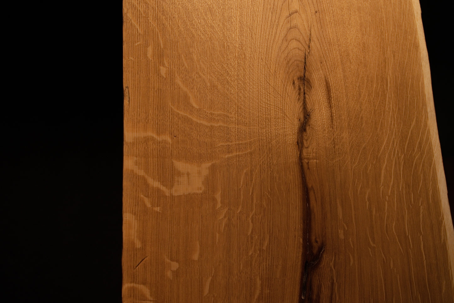 Detailed side profile edge of the custom oak architectural panel revealing clean precision milling and warm golden grain color. 