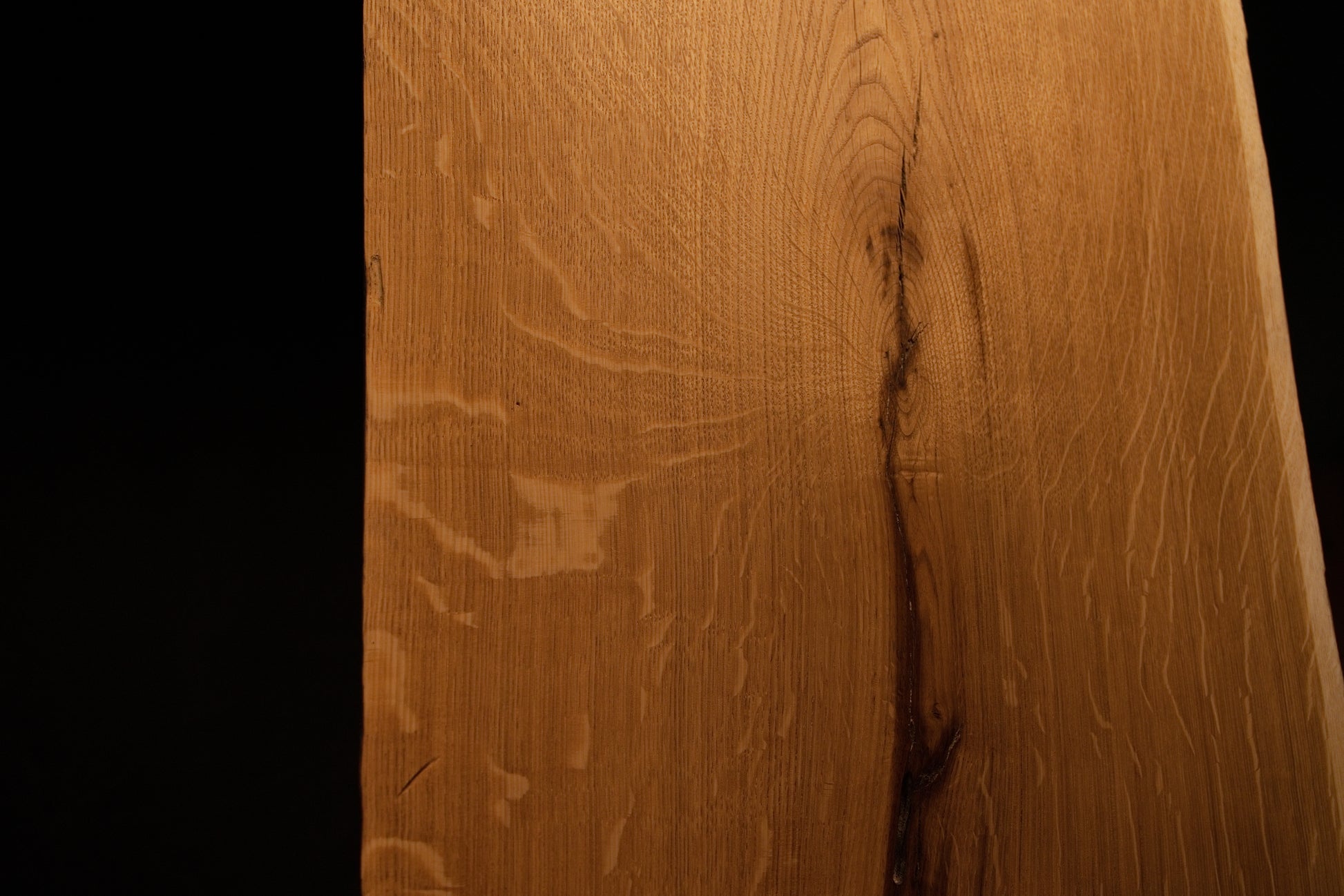 Detailed side profile edge of the custom oak architectural panel revealing clean precision milling and warm golden grain color. 