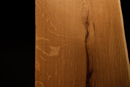 Detailed side profile edge of the custom oak architectural panel revealing clean precision milling and warm golden grain color. 