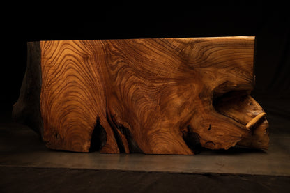 Perspective orientation of the heavy wooden root block displaying intricate sculptural contours and fluid grain flow.  