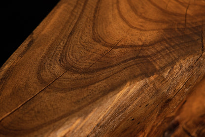 Warm golden wood grain curves gracefully across the surface of a solid organic hardwood root sculpture.  