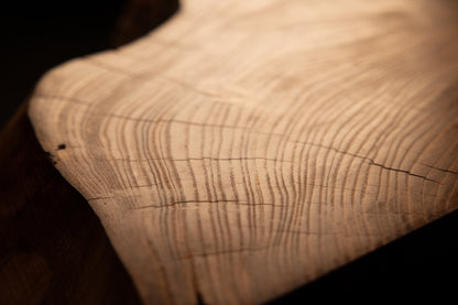 Macro documentation highlighting dense parallel grain lines and minimal surface checking across the finished timber piece. 